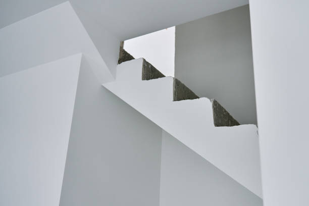 istock Unfinished concrete staircase in modern interior. New apartment 2202988480
