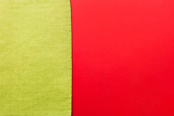 top view with green kitchen napkin isolated on table background. Folded cloth for mockup with copy space, Flat lay. Minimal style.