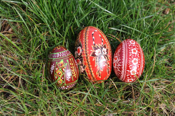 istock Traditional hand-dyed and hand-painted Easter eggs on the green grass in Poland called pisanka or kroszonka or kraszonka 2202990689