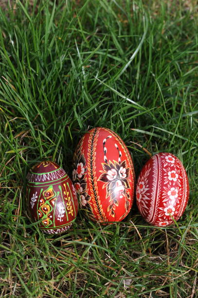 istock Traditional hand-dyed and hand-painted Easter eggs on the green grass in Poland called pisanka or kroszonka or kraszonka 2202990716