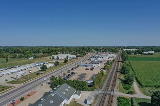 istock Aerial view of small town with railway and greenery. 2202990873