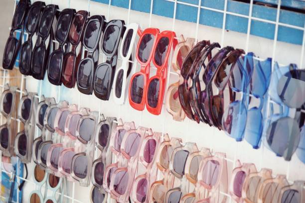 istock Beautiful colorful pattern shape texture sunglasses on a beach stall view 2202993034