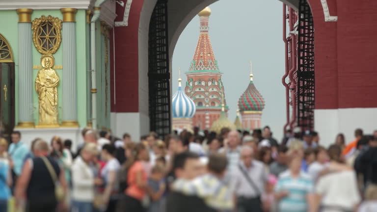 Colorful towers of an elegant posh church in Russia. Christians coming to pray