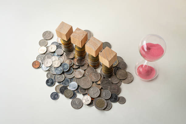 The photograph displays a pile of coins neatly arranged on a flat surface.