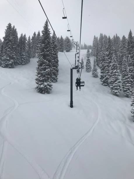 istock Ski Lift Over Snowy Forest 2202997215