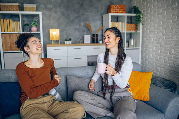 istock Two roommates are having a conversation in the living room 2202998204