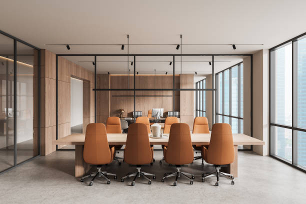 istock Modern office interior with large wooden conference table and brown chairs. 3D Rendering 2202998353