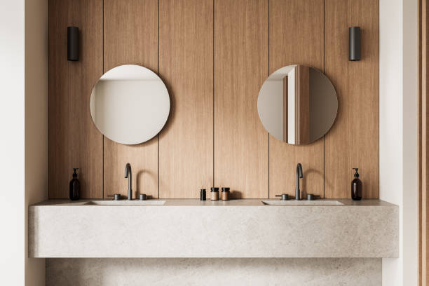 istock Modern bathroom interior with wooden panel walls and dual sinks. 3D Rendering 2202998588