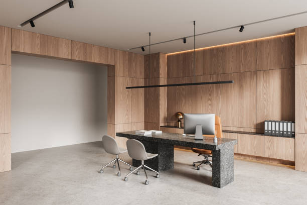 istock Modern office interior with wooden wall panels and terrazzo desk. 3D Rendering 2202999192