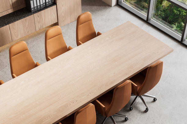 istock Modern office interior with wooden conference table and brown chairs. 3D Rendering 2202999672