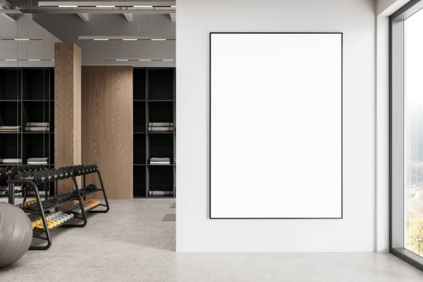 istock Blank poster mockup in modern gym interior with workout equipment. 3D Rendering 2202999965