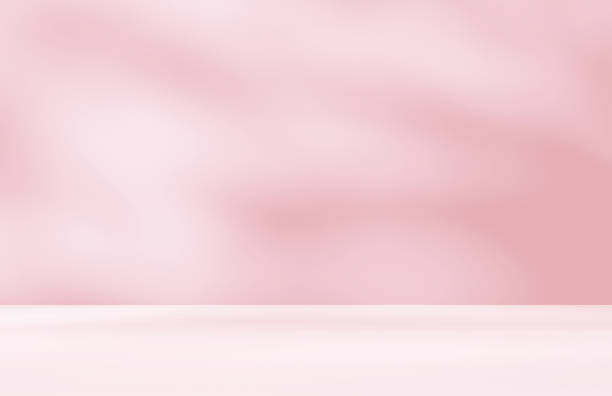 istock Empty pink colour room studio with sunlight effect shadow on the floor and wall for product presentation. 2203001282
