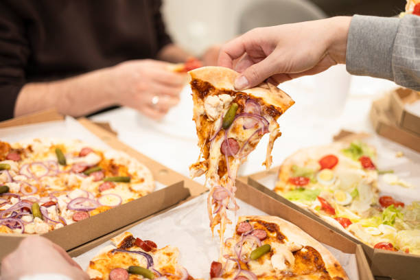 istock Pizza with mozzarella cheese topped with sliced onion, sausage with pickles. 2203002356