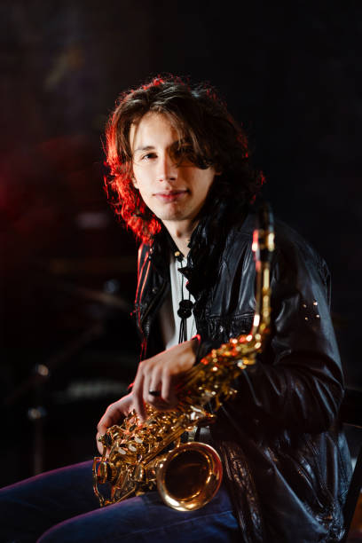 istock Portrait of a young saxophonist in a recording studio 2203003159