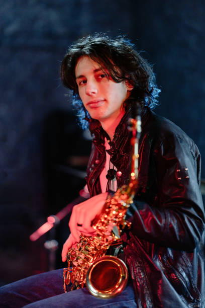 istock Portrait of a young saxophonist in a recording studio 2203003160
