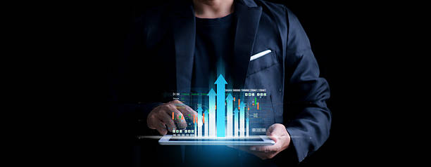 istock Businessman analyzing forex trading graph financial data. Business finance background.business finance technology and investment concept. Stock Market Investments Funds and Digital Assets. 2203004490