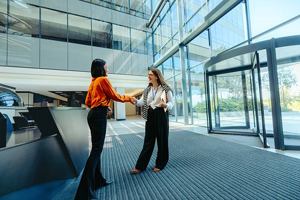 istock Welcome meeting for new hire in modern office lobby 2203005090