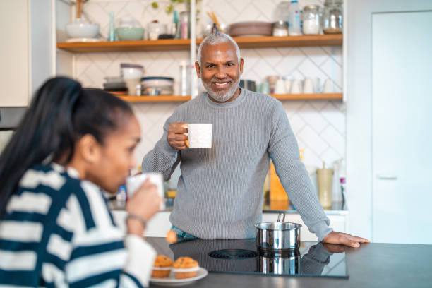 istock Mature Hispanic Couple Enjoying Tea in Modern Kitchen 2203008376