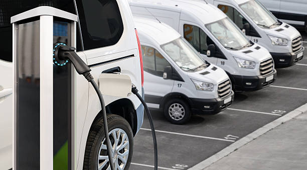 istock Electric delivery van with electric vehicles charging station. 2203009601