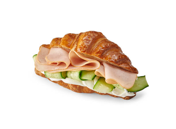 istock Croissant sandwich isolated on the white table, cheese, lettuce, various vegetables. 2203009974