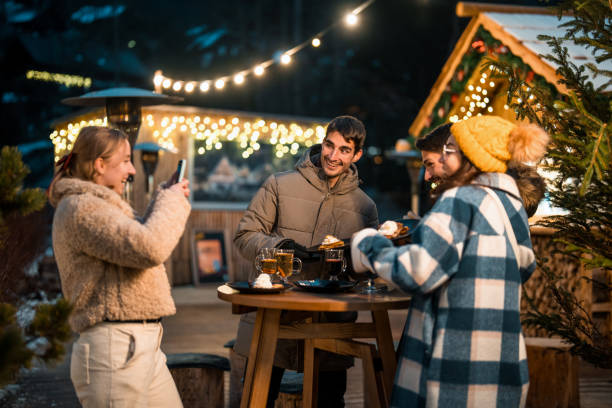 istock Friends Laughing Over Hot Drinks at Cozy Winter Evening Gathering 2203010972