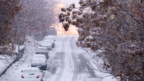 istock Romantic view of heavy snowfall with street lights. 2203011780