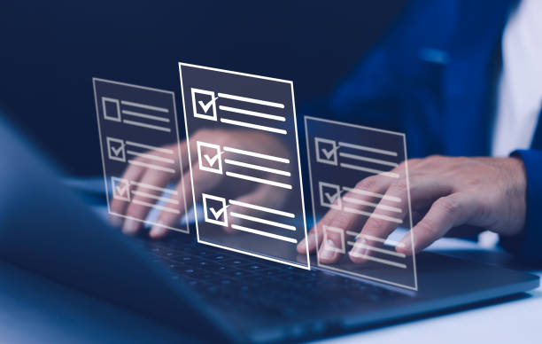 istock A person types on laptop with digital survey checklists, symbolizing online surveys, test-taking, and data collection. The concept represents digital forms, education, and modern learning technology. 2203012932