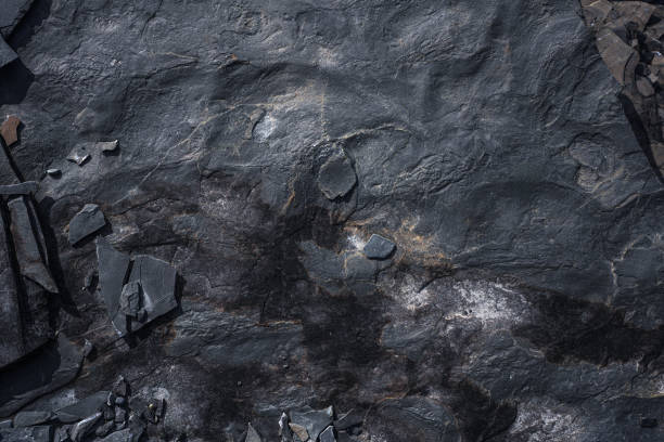 istock Rough Dark Slate Rock Texture With Natural Surface and Cracks 2203013383