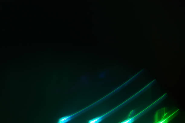 istock Colorful light leak on black background, abstract design with optical lens flare shot on a long lens 2203017879