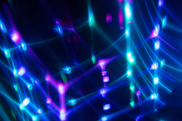 istock Abstract blurred colorful lens flare bokeh on black, 2203018418