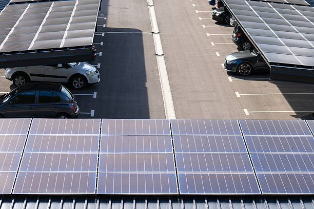 istock Parking space with solar panels on a roof. Solar canopy. 2203020863