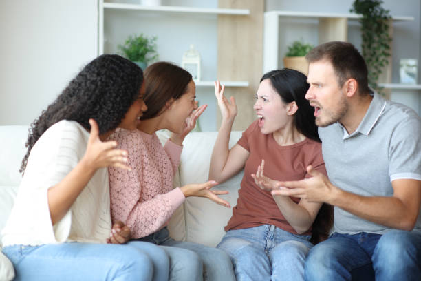 istock Four roommates arguing at home 2203021115