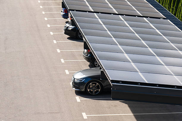 istock Parking space with solar panels on a roof. Solar canopy. 2203021621