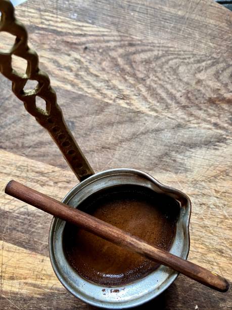 istock Aromatic Turkish coffee in a copper cezve with rich foam. 2203022429