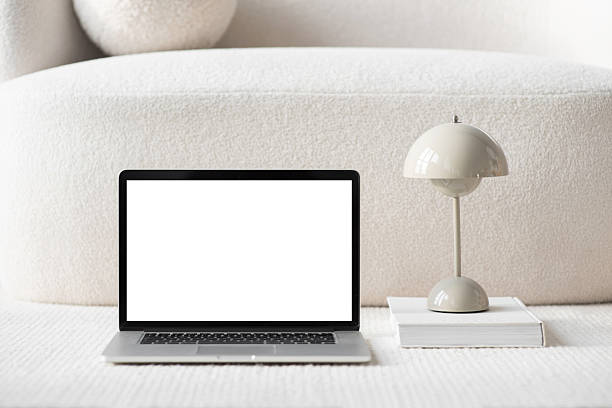 istock Cozy place of work. Laptop with blank empty screen mockup at home 2203025305