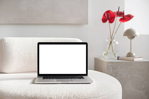 istock Cozy place of work. Laptop with blank empty screen mockup at home 2203025393