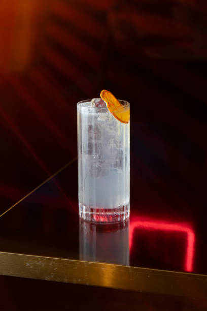 istock Cocktail at a table in an elegant restaurant reflective red LED lights 2203026135