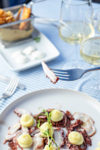 istock Octopus and potato cream at the seaside restaurant 2203027221