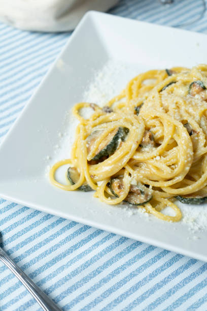 istock Spaghetti with zucchini Nerano style at the seaside restaurant 2203027378