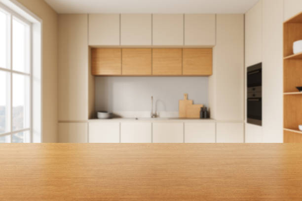 istock Wooden countertop in a modern beige kitchen interior with blurred background. 3D Rendering 2203027679
