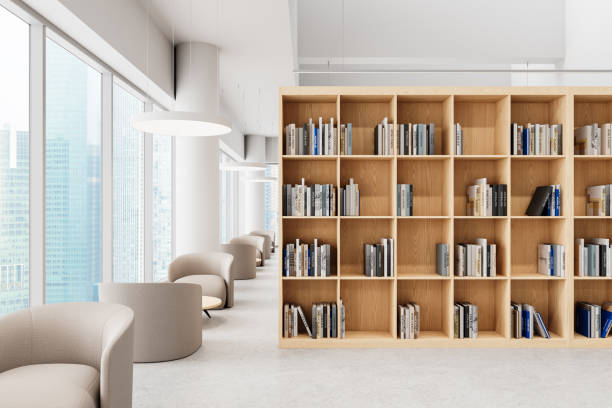 istock Modern library interior with wooden bookshelves and comfortable seating area. 3D Rendering 2203028899