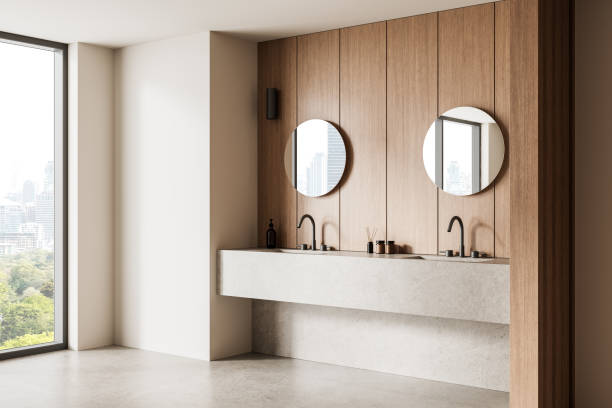 istock Modern minimalist bathroom interior with wood panel walls and a large concrete sink. 3D Rendering 2203029179
