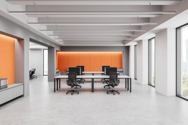 istock Modern open office space with contemporary design and bright orange accents. 3D Rendering 2203029191