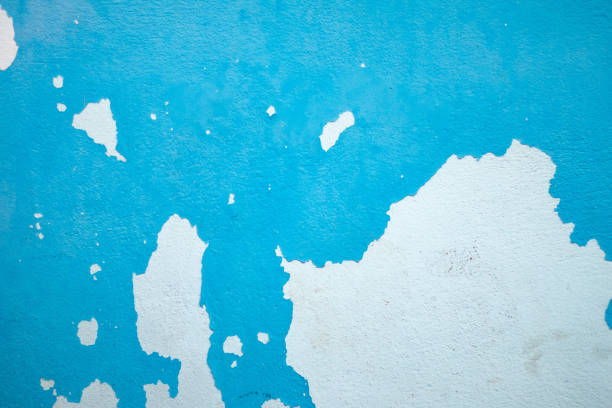 Weathered blue wall with peeling paint, grunge texture ideal for creative design and photography backdrops