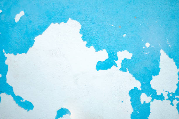 Weathered blue wall with peeling paint, grunge texture ideal for creative design and photography backdrops