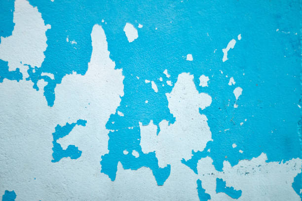 Weathered blue wall with peeling paint, grunge texture ideal for creative design and photography backdrops