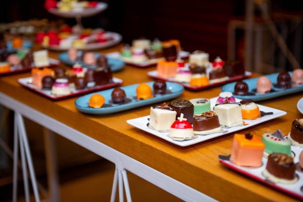 Delightful assortment of artisan chocolates displayed on a vibrant plate at an event dedicated to sweet treats during a festive gathering