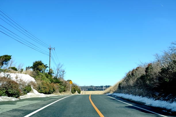 istock Scenic Rural Road in Winter 2203031813