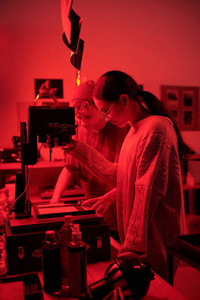 istock Two Teenagers Working in Darkroom 2203032751