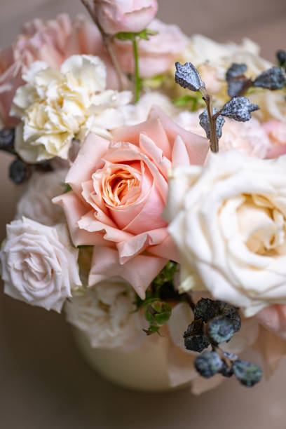 istock Delicate composition of white and pink roses in a basket 2203033060